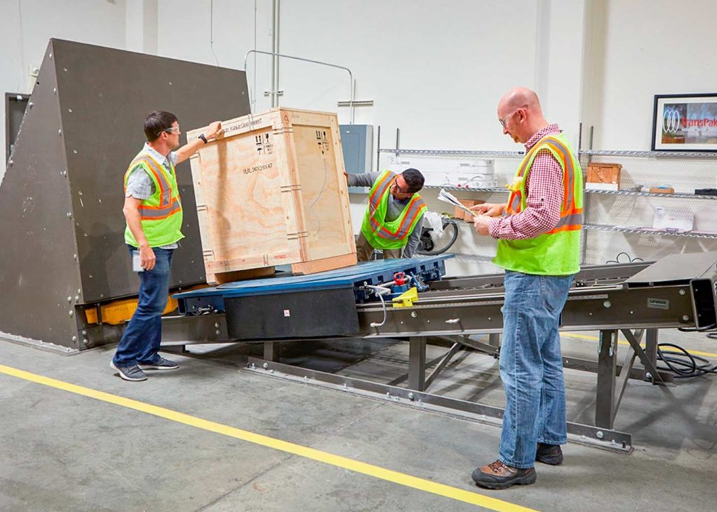 incline-testing-equipment-being-reviewed-by-team