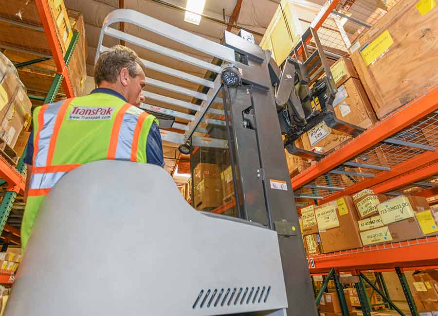 transpak-employee-using-forklift-to-load-order